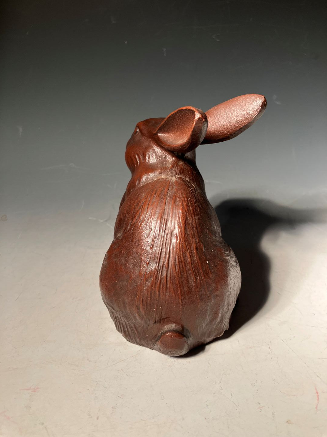 back part in a grey room