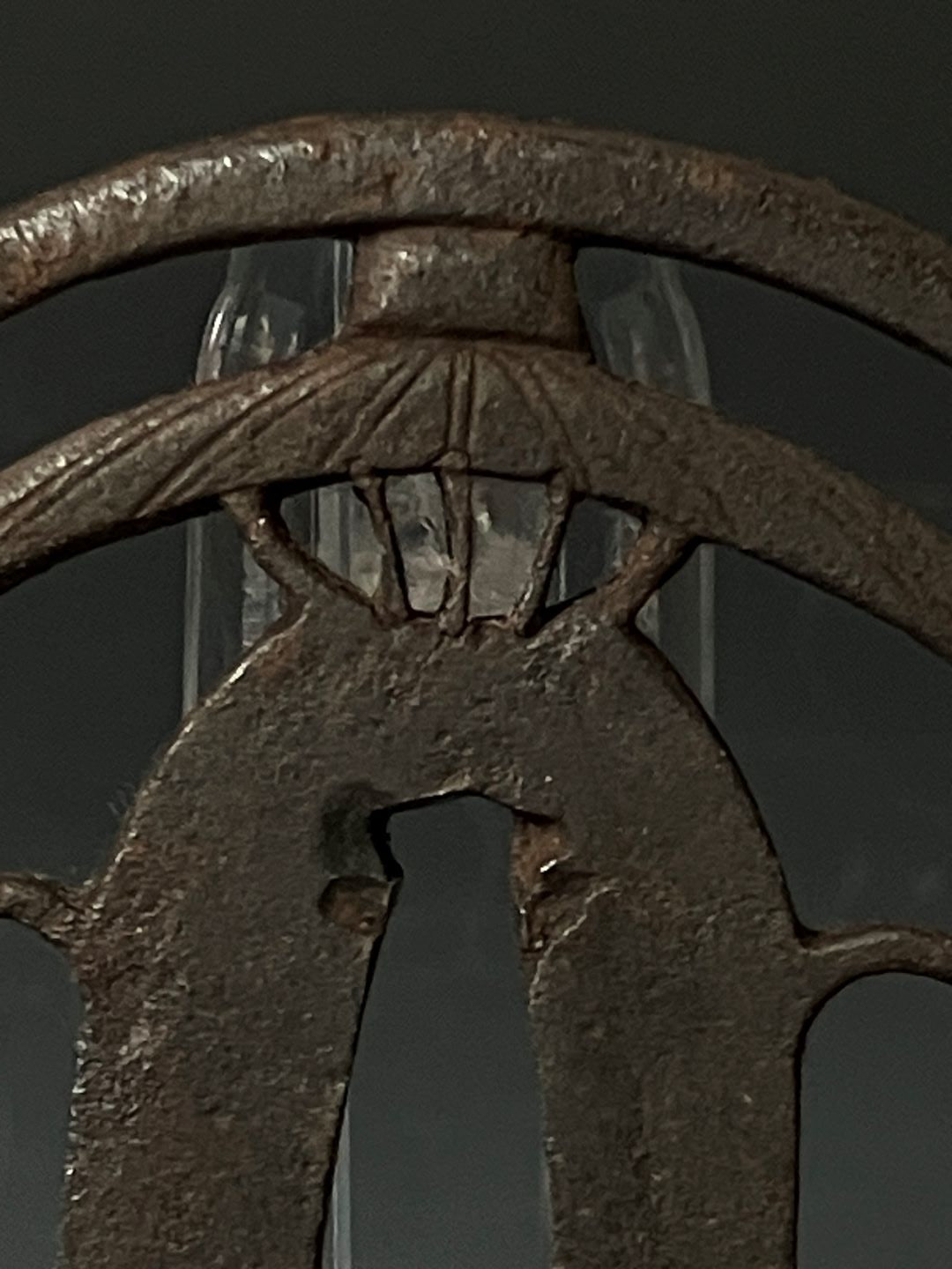 Close-up of a rusty metal object with a dark background