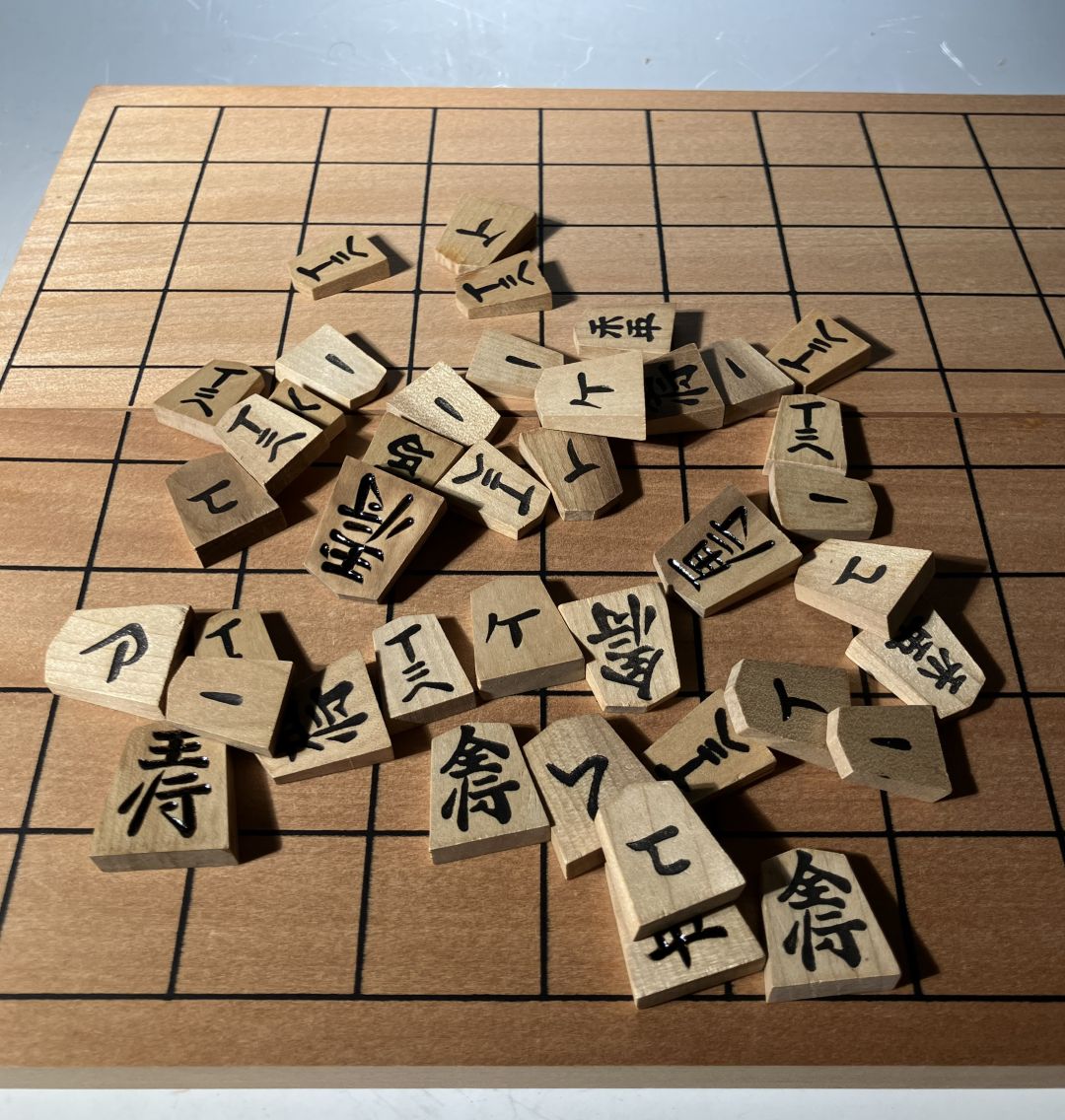 Wooden Chinese characters tiles on a wooden board