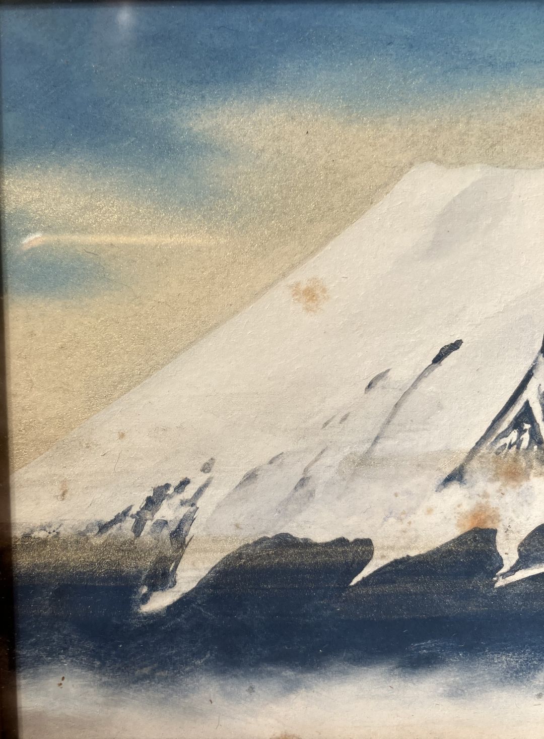 Artistic depiction of a mountain with a blue sky and clouds