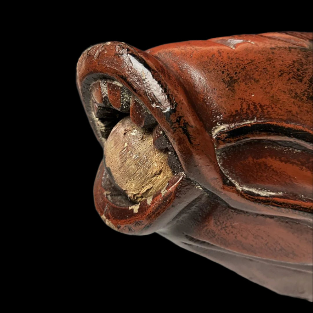 Close-up of an aged wooden fish carving mouth and nose detail, displaying chipped paint and a rustic patina indicative of traditional Japanese Jizaikagi craftsmanship.