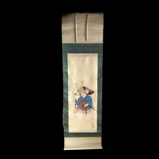 A Japanese art roll painting of child with a helmet in a tatami room