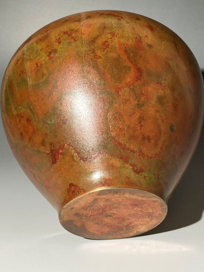 Decorative vase with a textured surface on a white background