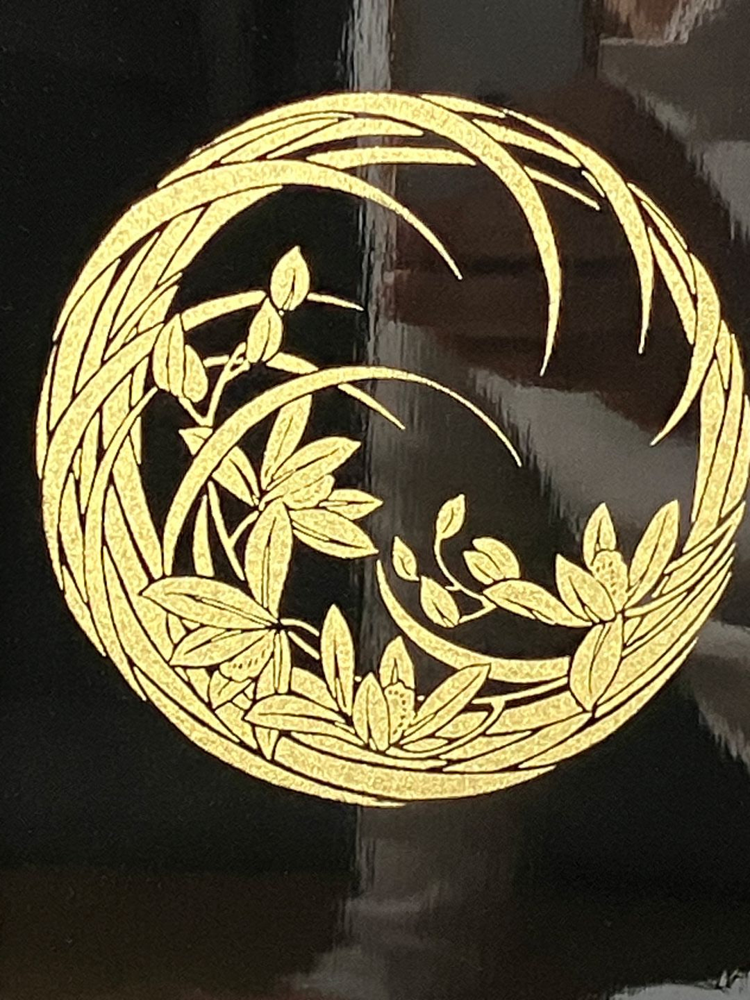 gold design on a black folder