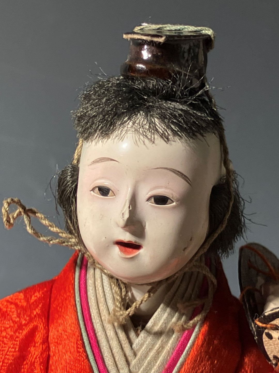 Close-up of a traditional doll with a plain background
