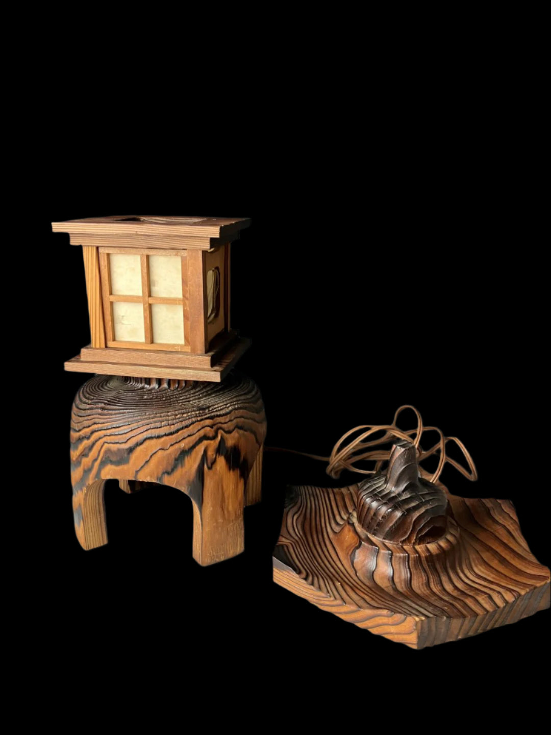 Japanese Akita cedar wood lantern with its detachable pagoda-style roof displayed alongside the base, highlighting the intricate craftsmanship, shoji paper panels, and natural wood grain.