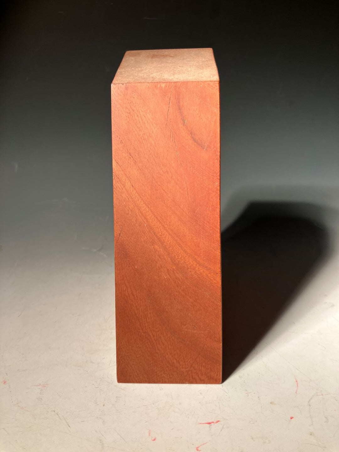 Wooden block on a dark surface
