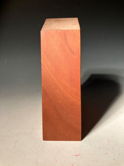 Wooden block on a dark surface