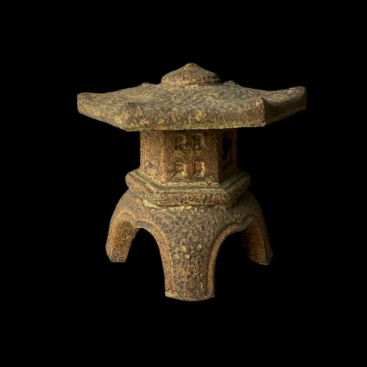 Vintage Japanese ceramic temple lantern in Ishidoro design, featuring a textured finish, intricate cut-out patterns, and a traditional pagoda-style structure, standing 13cm tall.