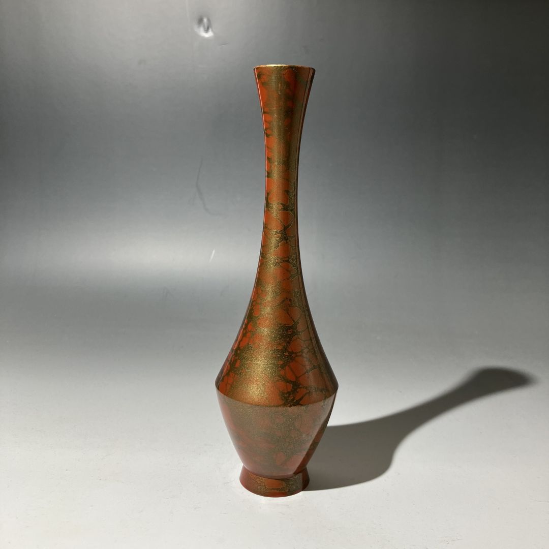 Bronze vase on a gray background