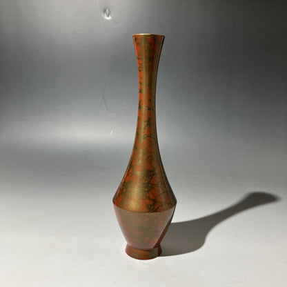 Bronze vase on a gray background
