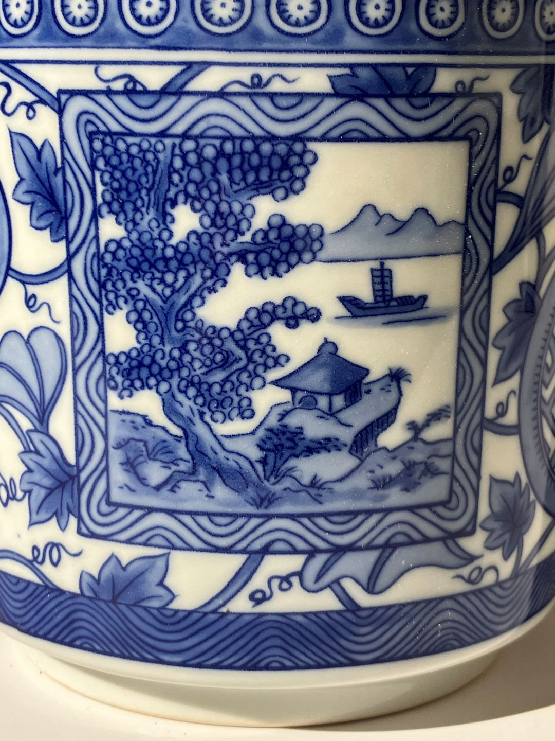 Close-up of a blue and white ceramic plate with intricate designs.