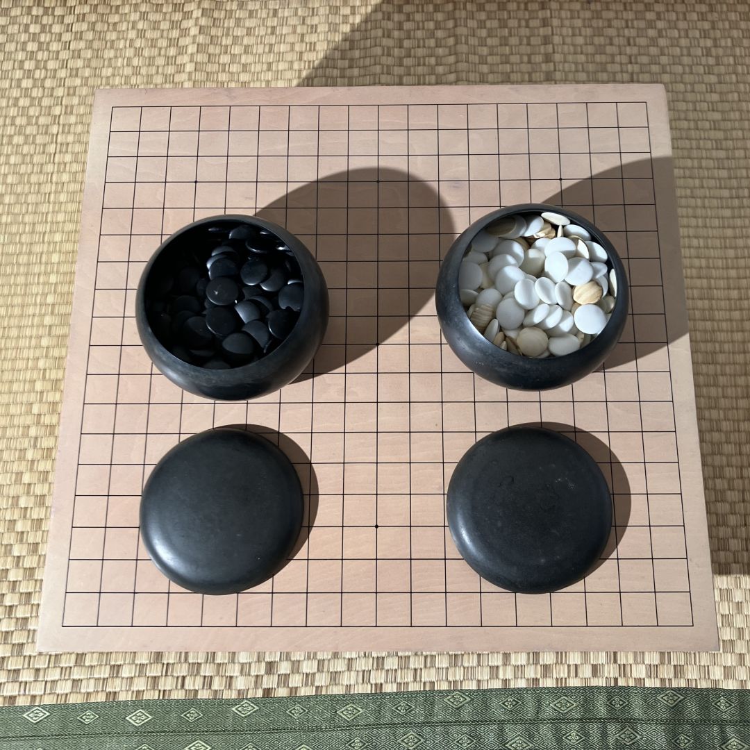 two go bowls on a go board game
