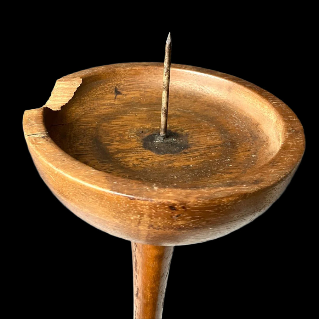 Close-up view of the vintage Japanese wooden candle stand's cup-like holder with a central spike, showcasing its aged patina and minimalist craftsmanship.