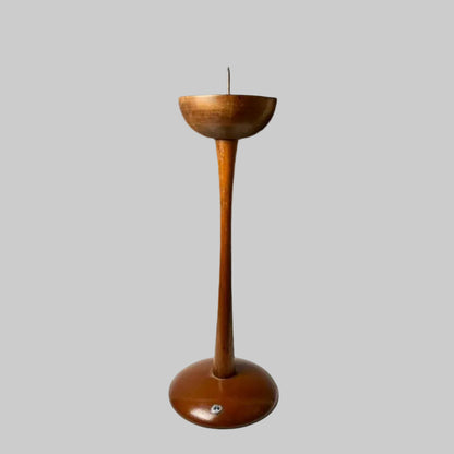 Vintage Japanese wooden candle stand with a slim, gracefully curved base and a polished finish, featuring a cup-like holder with a central spike, crafted in a minimalist Showa-style design.