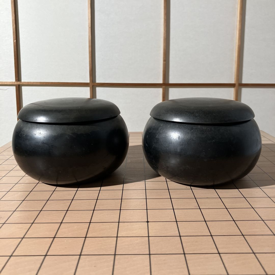two go bowls on a board game