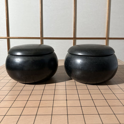 two go bowls on a board game